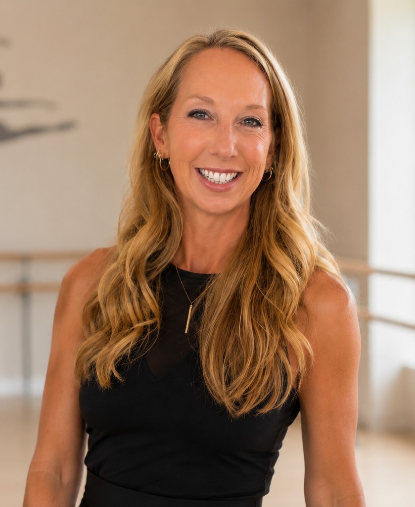 Stacey Benson, founder and instructor of Movin 'n' Groovin', smiling in the dance studio